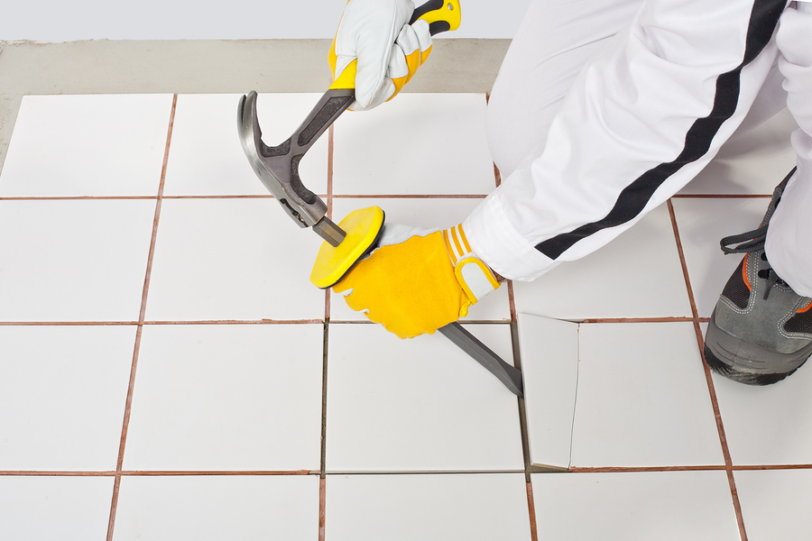 a professional tile remover removing tiles