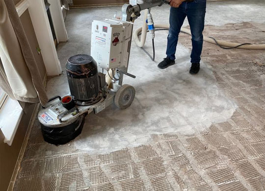 Professional worker cleaning tile in Dallas, Fort Worth